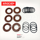 Top view of WINSCHEN 566-32-05211 front brake seal kit with seals and rings laid out