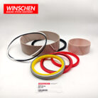 229-5546 tilt cylinder seal kit, low-angle view with red and yellow seals in front