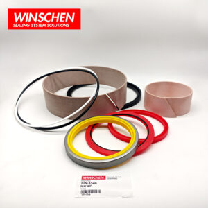 229-5546 tilt cylinder seal kit, low-angle view with red and yellow seals in front