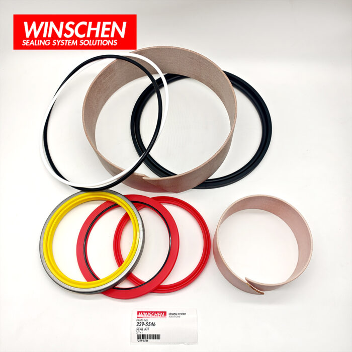 229-5546 tilt cylinder seal kit, top view with red seals and tan wear rings